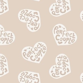 Perfect couple - groovy vintage style wedding design typography text on hearts with arrows sand 
