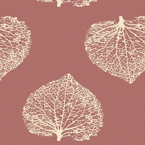 Leaf skeleton in warm tones in a textured background