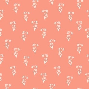 Dainty Wildflower Floral of Off White Flowers on a Peach Background