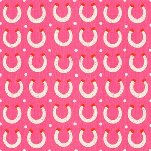 Retro western horseshoes on a hot pink background