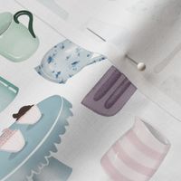 Kitchen utensils and handmade pottery in muted blue green and grey pink