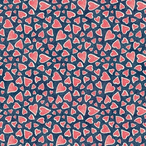 Hand drawn tossed red hearts on dark denim blue