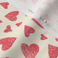 Hand drawn tossed red hearts on cream