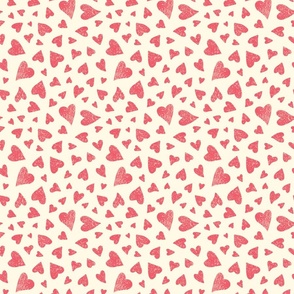 Hand drawn tossed red hearts on cream