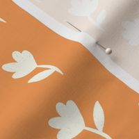 Playful Wildflowers: Minimalist Floral Silhouettes on a Red Orange Background