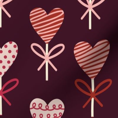 Large Valentine's Day Chocolate Heart Lollipops on Maroon