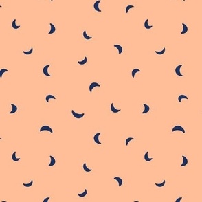 Small scale folk art moon scatter print in peach fuzz and navy blue