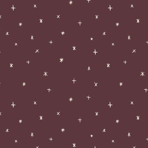 Small scale folk art style stars in the night sky in purple brown.