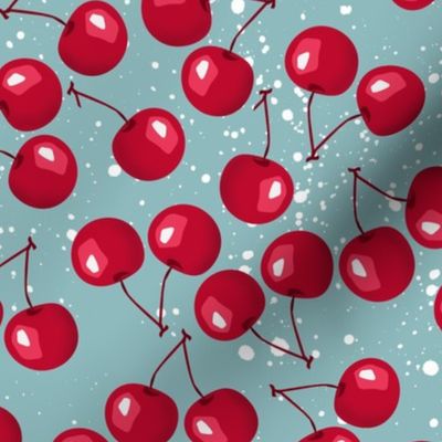 Red cherry berries on a turquoise background.