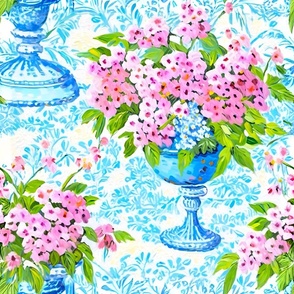 Pink daisies in blue classic urns
