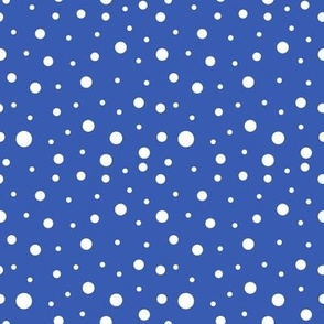 White scattered polka dots on blue 