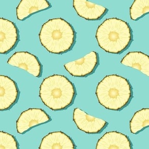 Pineapple slices on turquoise background