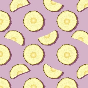 Pineapple slices on a lilac background