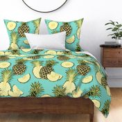 Ripe pineapples, turquoise background