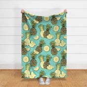 Ripe pineapples, turquoise background