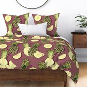 Ripe pineapples, burgundy background
