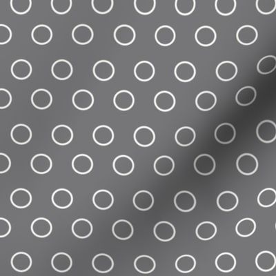 Graphic circles or open dots, white on gray.