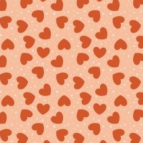 Small tossed Hearts with stars rusty red on peach fuzz | f6be9d