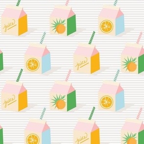Small-Scale retro orange juice milk carton with striped straws
