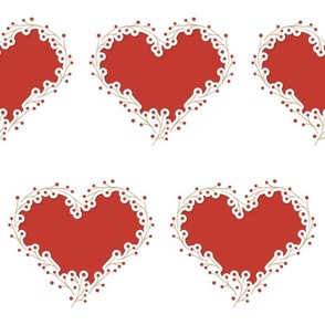 cutout style floral heart shapes made of tiny branches with red berries