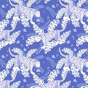 white tiger and tropical leaves on blue background