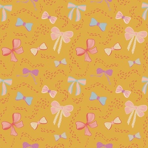 Bows and Bows fabric in shades of pink with golden yellow background