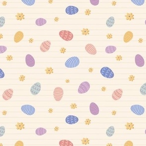 Colourful tossed easter eggs on stripe in cream