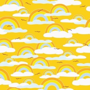 Soft Rainbows, White Clouds and High Flying Birds in a Yellow Sky