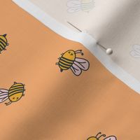 Bees on orange profile view