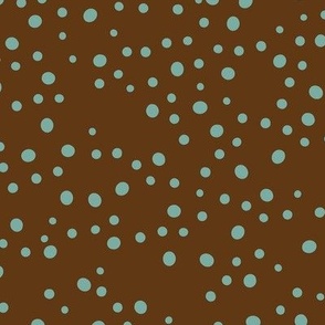 Turquoise Dots Hand-drawn and Scattered on a Chocolate Brown Background