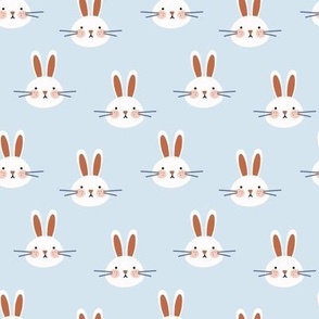 Cute  Easter bunnies, rabbits on light blue