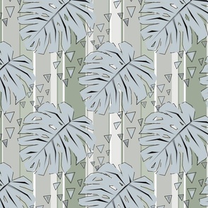 Gray monstera leaves on a striped gray-green background.  