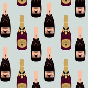 Party time! Champagne bottles on light blue background
