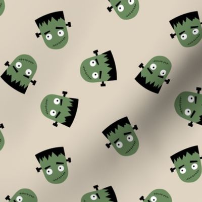 Cutesy Frankentein robot faces - halloween zombie design olive green on sand