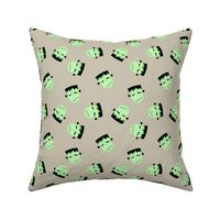 Cutesy Frankentein robot faces - halloween zombie design neon green on beige