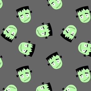 Cutesy Frankentein robot faces - halloween zombie design neon green on charcoal gray