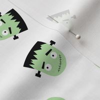 Cutesy Frankentein robot faces - halloween zombie design green on ivory