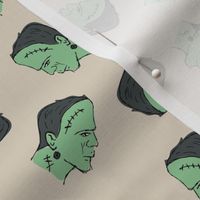 Grunge style freehand Frankenstein halloween design green on sand