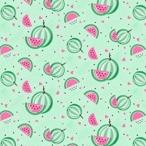 Pastel watermelons on a soft green background - small scale
