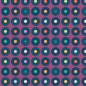 Vintage vinyl records multicolored on a grape purple background