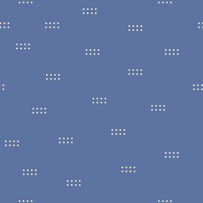 White scattered dots on blue background