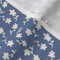 Ditsy flowers monochrome off-white on blue