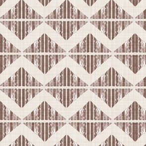 Large - A block printed design of triangles and squares and a graphic zigzag of flax coloured textured linen. Mocha, burgundy, brown and rosewood.