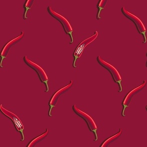 Hot peppers on a dark red background