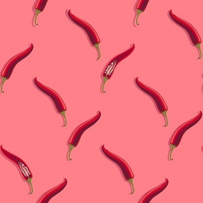 Hot peppers on a pink background