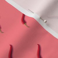 Small hot pepper on a pink background