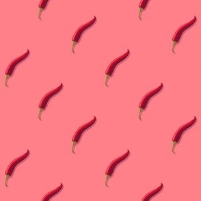 Small hot pepper on a pink background