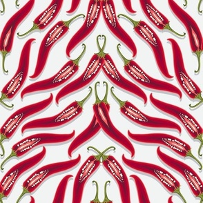 Dense pattern of hot peppers on a white background