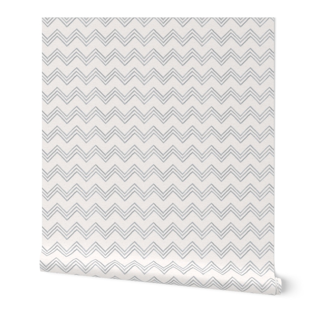 Hand drawn watercolor chevron zig zag stripes – painted geometric brush strokes on a warm cream watercolour paper texture. Beige and ecru with upward grey and slate blue-gray.