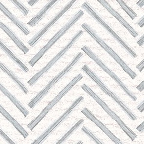 Hand drawn watercolor herringbone pattern – painted geometric brush strokes on a warm cream watercolour paper texture. Beige and ecru with upward grey and slate blue-gray.